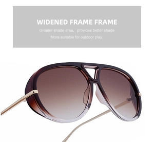 Detail of retro pilot sunglasses featuring widened frames and gradient brown lenses