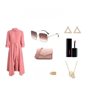Flat lay of pink dress with luxury rimless sunglasses, handbag and gold jewelry set