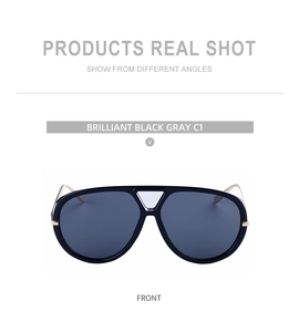 Front view of aviator sunglasses with black double-bridge frame and gold metal temples