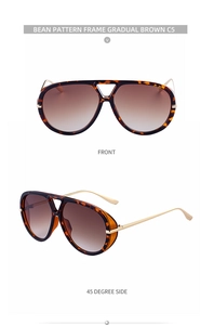 Close-up of tortoise shell aviator sunglasses with brown gradient lenses and gold temples