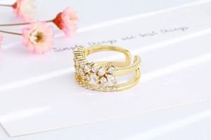 Detail of a double-layered gold open ring with marquise-cut marquise zircon inlays