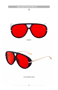 Detail view of retro aviator sunglasses with black frames and vibrant red lenses