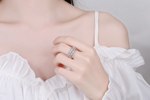 Close-up of double-layered silver ring set with sparkling marquise and round zircon stones