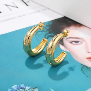 Vintage chunky gold C-shape hoop earrings with star engravings and zircon stones
