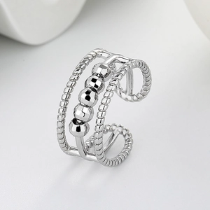 Three-layer silver spinning bead ring with twisted texture for anxiety relief