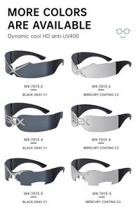 Detail view of Y2K rimless sunglasses featuring UV400 lenses and metallic X-shape accents