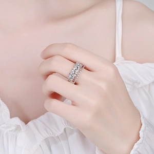 Double-layer silver ring set with marquise cut cubic zirconia on a female finger