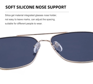 Close-up of adjustable silicone nose pads on square metal frame sunglasses with double bridge