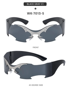 Detail of Y2K rimless sunglasses with silver metal bat wing decor and industrial rivets