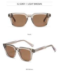 Detail view of square grey translucent sunglasses with light brown lenses and arrow texture
