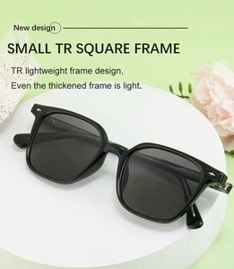 Close-up of black square TR sunglasses with metallic accents on temple hinges
