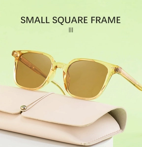 Detail of yellow transparent square frame sunglasses with leather folding case