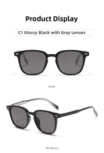 Detail of square black sunglasses with silver rivets and grey anti-UV lenses