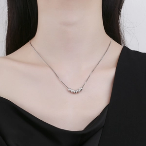 Elegant silver beads necklace with matte finish pendant on minimalist chain for women