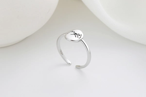 Detailed macro shot of S925 sterling silver pinky swear engraved adjustable ring
