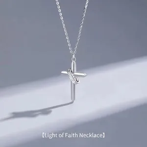 Polished silver cross necklace with FAITH engraved ring and micro-inlaid stones