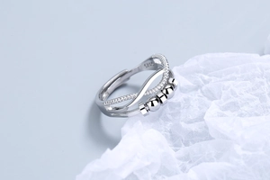 Detail shot of adjustable silver anxiety ring with rotating beads and S925 stamp