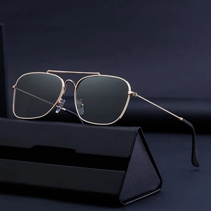 Square pilot sunglasses with gold metal frame and dark grey lenses including case