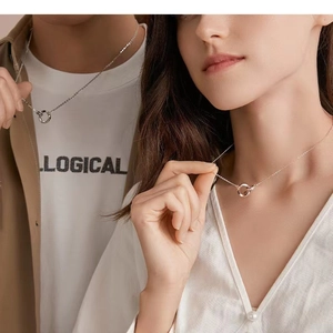 Interlocking Mobius rings couple necklaces in silver and rose gold for long distance gifts
