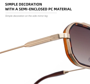 Détails des branches en métal doré clair et décoration sobre sur lunettes rétro