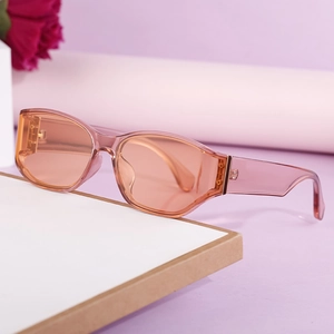Fashionable rectangle cat-eye sunglasses with transparent pink frames and orange lenses