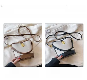Detailed comparison of beige canvas bucket bags in brown and black with metal clasp