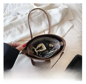 Internal view of fashion bucket bag with striped lining and large storage space