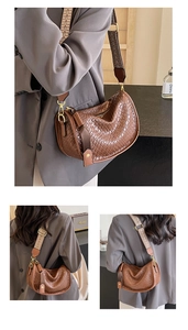 Detailed view of brown woven crossbody bag with a geometric pattern wide shoulder strap