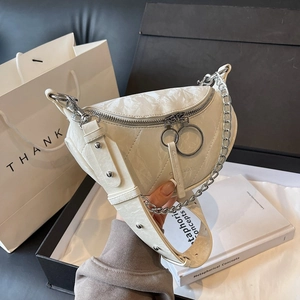 Chic cream crescent crossbody bag with marble texture and chunky silver chain