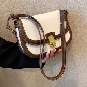 Retro cream and caramel saddle bag with metal twist lock and adjustable strap