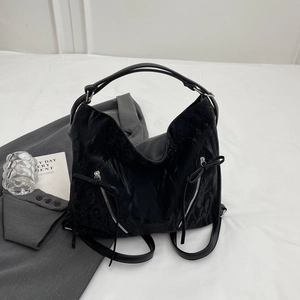 Large capacity black pleated tote bag with silver zippers and bow tie detail