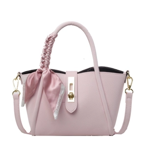 Pink lychee grain leather bucket bag with silk scarf handle and golden twist lock