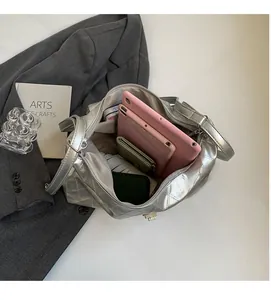 Interior view of silver quilted tote bag showing space for tablet and essentials