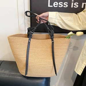 Large capacity straw woven tote bag with black handles in minimalist bohemian style