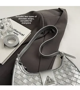 Silver woven half-moon shoulder bag with triangle clasp and dual strap options