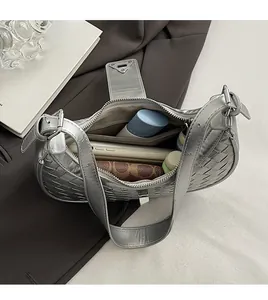 Detail view of silver woven hobo bag interior showing spacious storage for essentials
