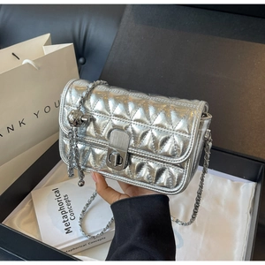 Silver quilted chain bag with metal clasp detail and aesthetic gift box packaging