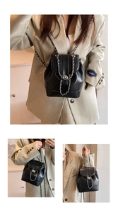 Detail of black water bucket backpack with chain straps and metallic twist-lock closure