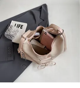 Detail of large capacity tote bag interior with umbrella and phone in a soft PU leather