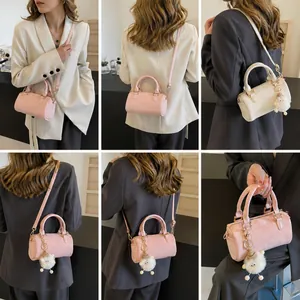 Detailed views of mini Boston bag in pink and white with cute sheep keychain charm