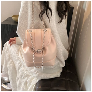 Fashionable chain bucket backpack in beige pink featuring a metal twist lock detail