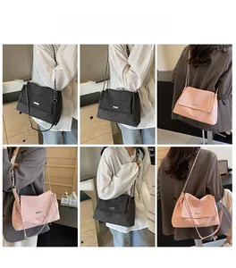 Multi-angle view of model wearing textured chain baguette bag in black and pink