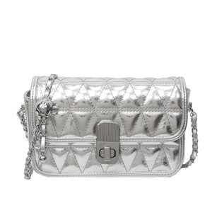Silver quilted shoulder bag with triangular pattern and metal chain strap in front view