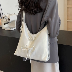 White large capacity PU leather tote bag with bow detail and chain strap on shoulder