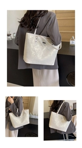 Detail view of large white tote bag with shimmering silver starlight crackle texture