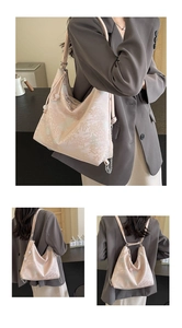 Detailed pink jacquard embroidery on versatile handbag with elegant silver chain strap