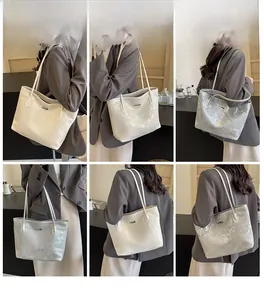 Multiple views of a metallic silver and off-white tote bag shown on a model in urban settings