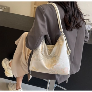 Detail of New Chinese style tote bag with floral jacquard embroidery and silver chain strap