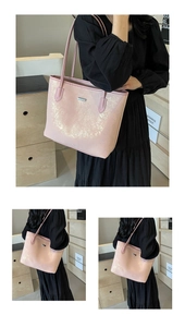 Detail of pink PU tote bag featuring shimmering gold texture and metal logo plate