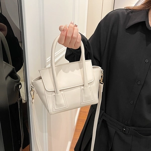 Elegant beige trapezoid bucket bag with adjustable shoulder strap for women